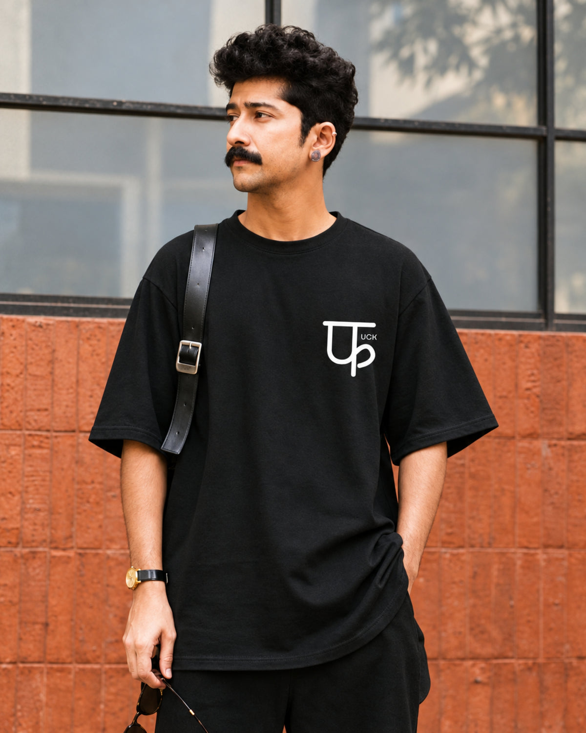 Model in the Minimalistic फuck black oversized tee