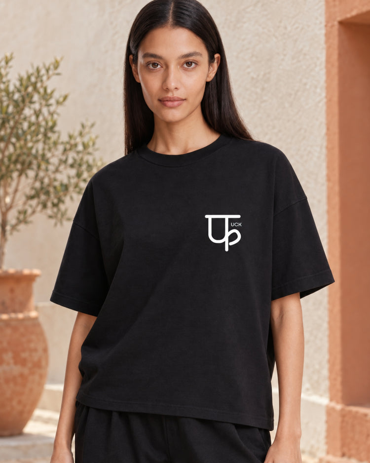 Model wearing the Minimalistic फuck black oversized tee