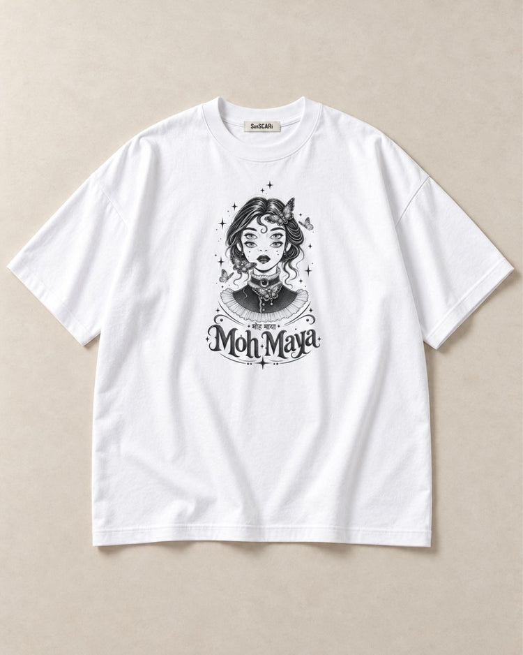 Moh Maya white oversized tee laid flat on a stone background