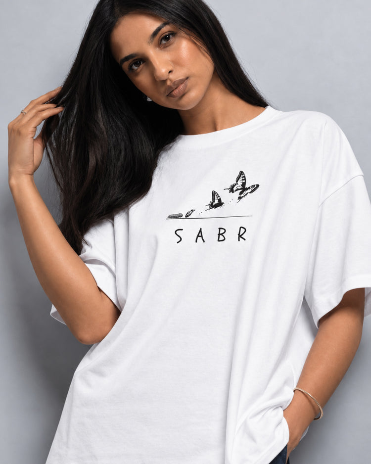 Model wearing the SABR white oversized tee