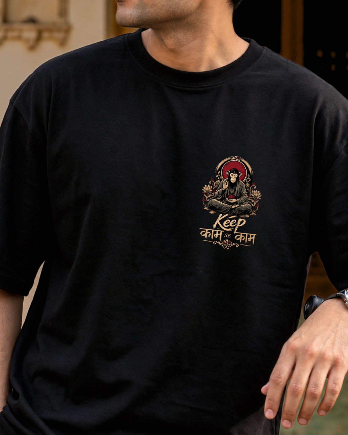 Keep काम se काम black oversized tee with a red and gold chest print