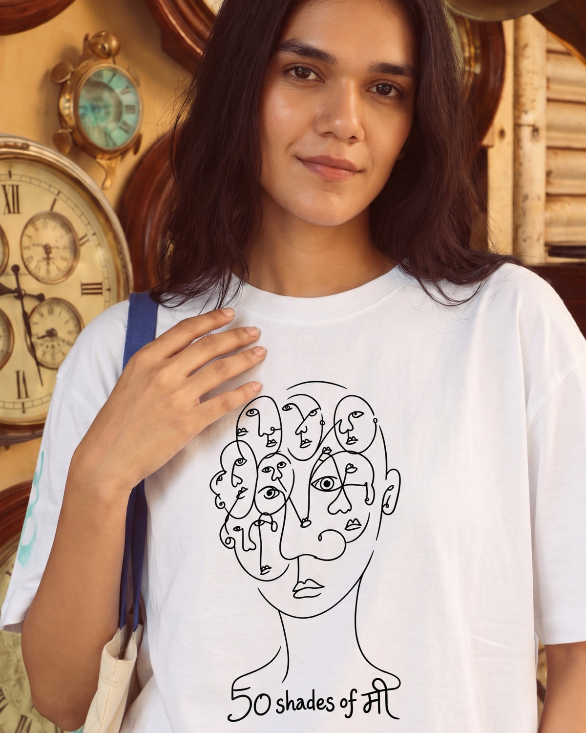 Model smiling in the 50 Shades of मी white oversized tee