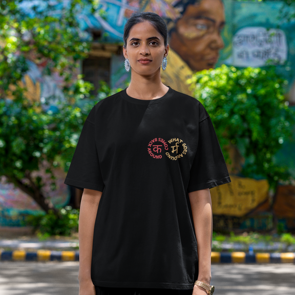 Indian streetwear Karma oversized t-shirt, Devanagari script design, unisex South Asian fashion for casual outings and party wear, available in Canada and America.