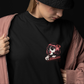 Model wearing the ‘Kaleshi’ tee with ripped jeans, showcasing its unisex drop-shoulder fit.