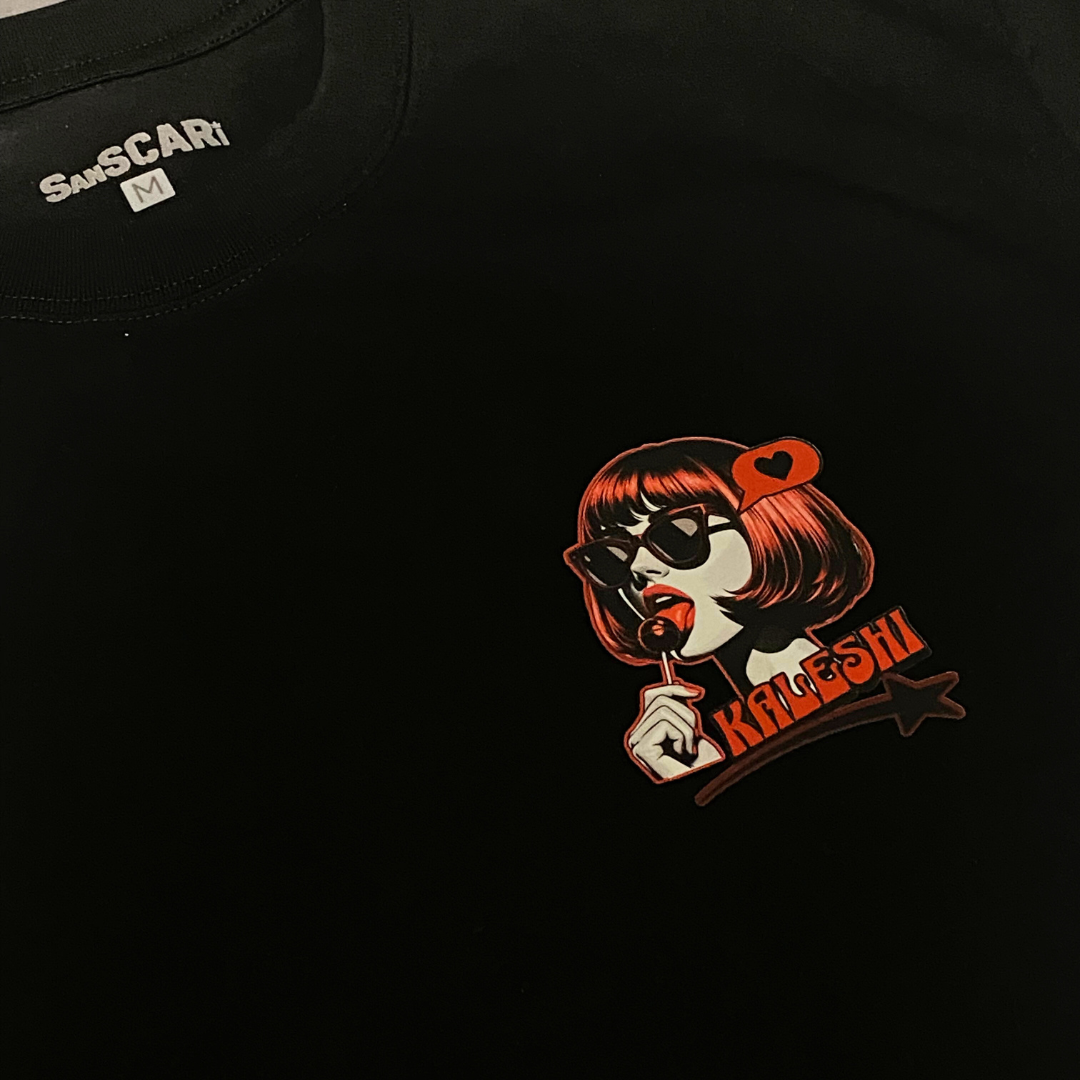 Kaleshi oversized black t-shirt with bold red lollipop graphic, perfect for Desi streetwear enthusiasts.