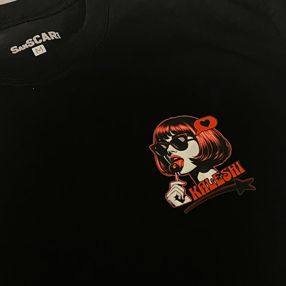 Kaleshi oversized black t-shirt with bold red lollipop graphic, perfect for Desi streetwear enthusiasts.